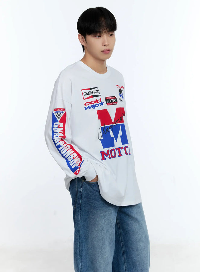 LEWKIN Men's Racing Graphic Long Sleeve T-Shirt IG515 in white, angled front view on model, oversized fit with bold red and blue MOTOR chest print, racing badge graphics, and Championship sleeve print, styled with wide-leg jeans.