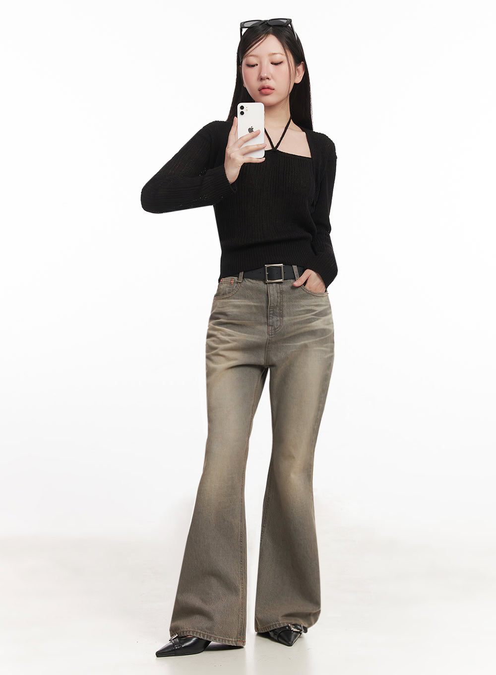 LEWKIN Sherry Washed Slim-Fit Bootcut Jeans IM528 in vintage brown, full-length front view on model taking mirror selfie, high-waist washed denim with bootcut flare, paired with black knit top and belt.