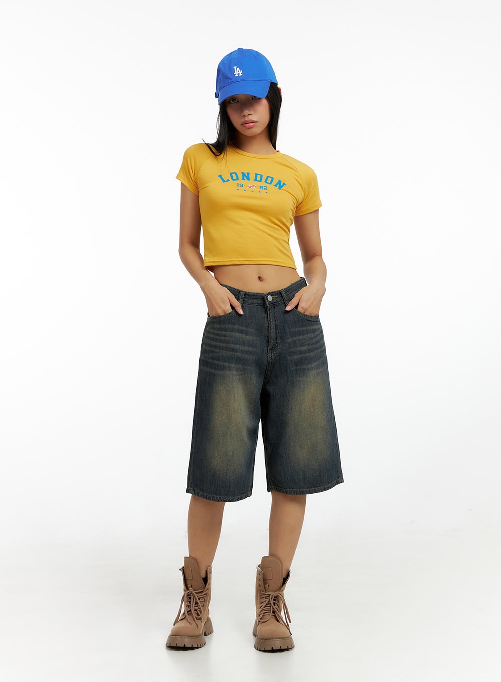 LEWKIN Dark Washed Wide Leg Jorts IL419 in dark blue, full front view on model, wide-leg knee-length denim with yellow-tinted wash, paired with yellow crop tee and combat boots.