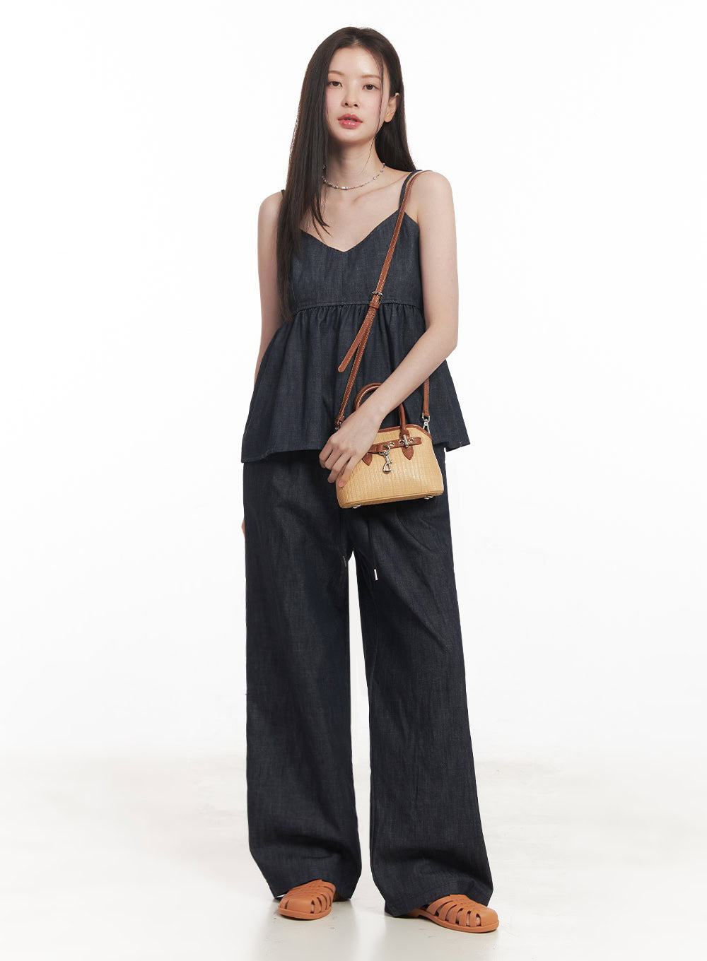 LEWKIN Cotton Denim Wide-Leg Pants IY509 in dark navy, full-length front-angled view on model, relaxed wide fit with banded drawstring waist, paired with denim cami top and tan woven mini bag.