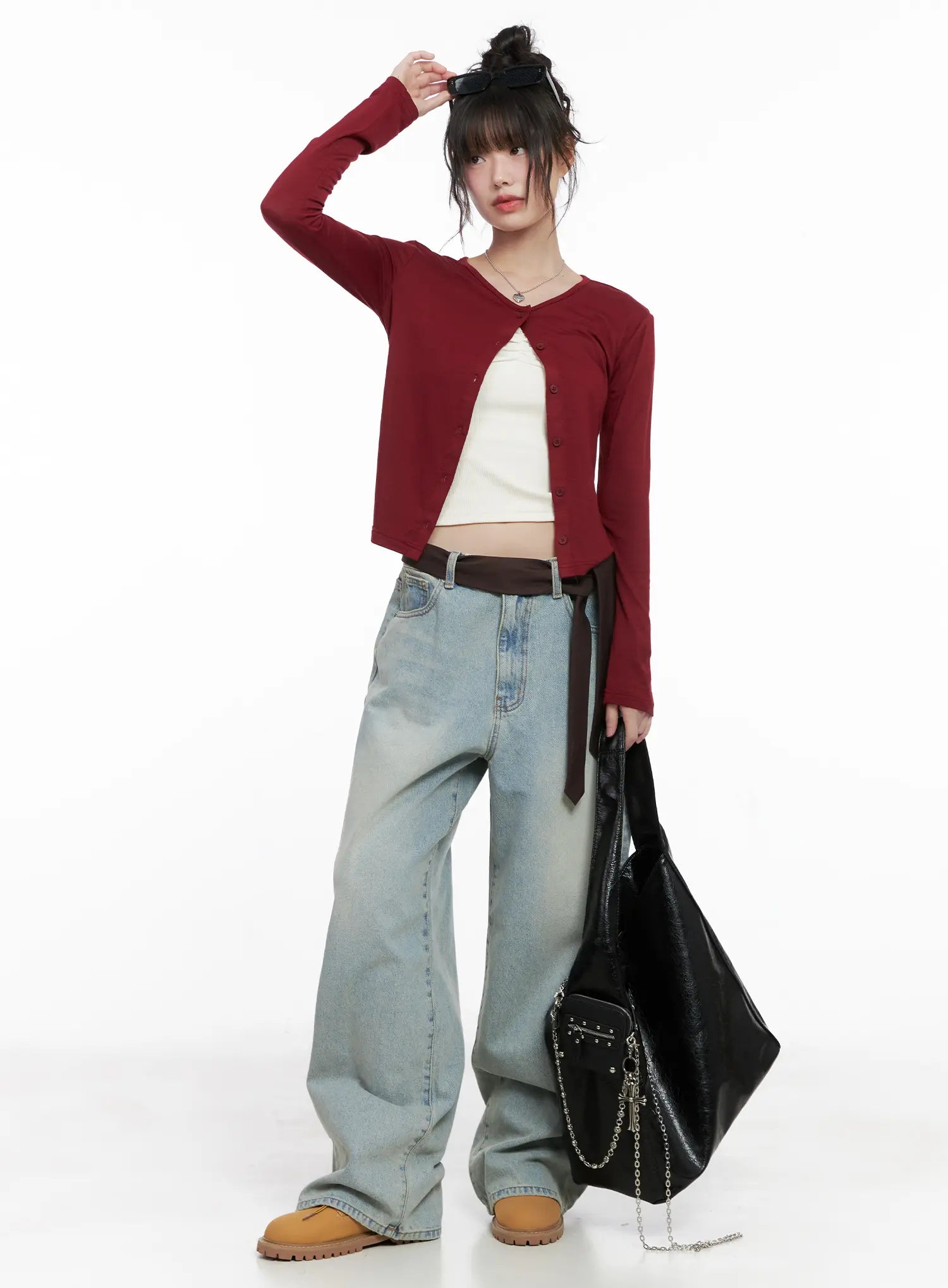 LEWKIN Lilly Light Wash Baggy Jeans CG519 in light blue, full-body front on model wearing red cardigan and cream cami, wide-leg cotton denim with brown belt, styled with tan boots and black tote.