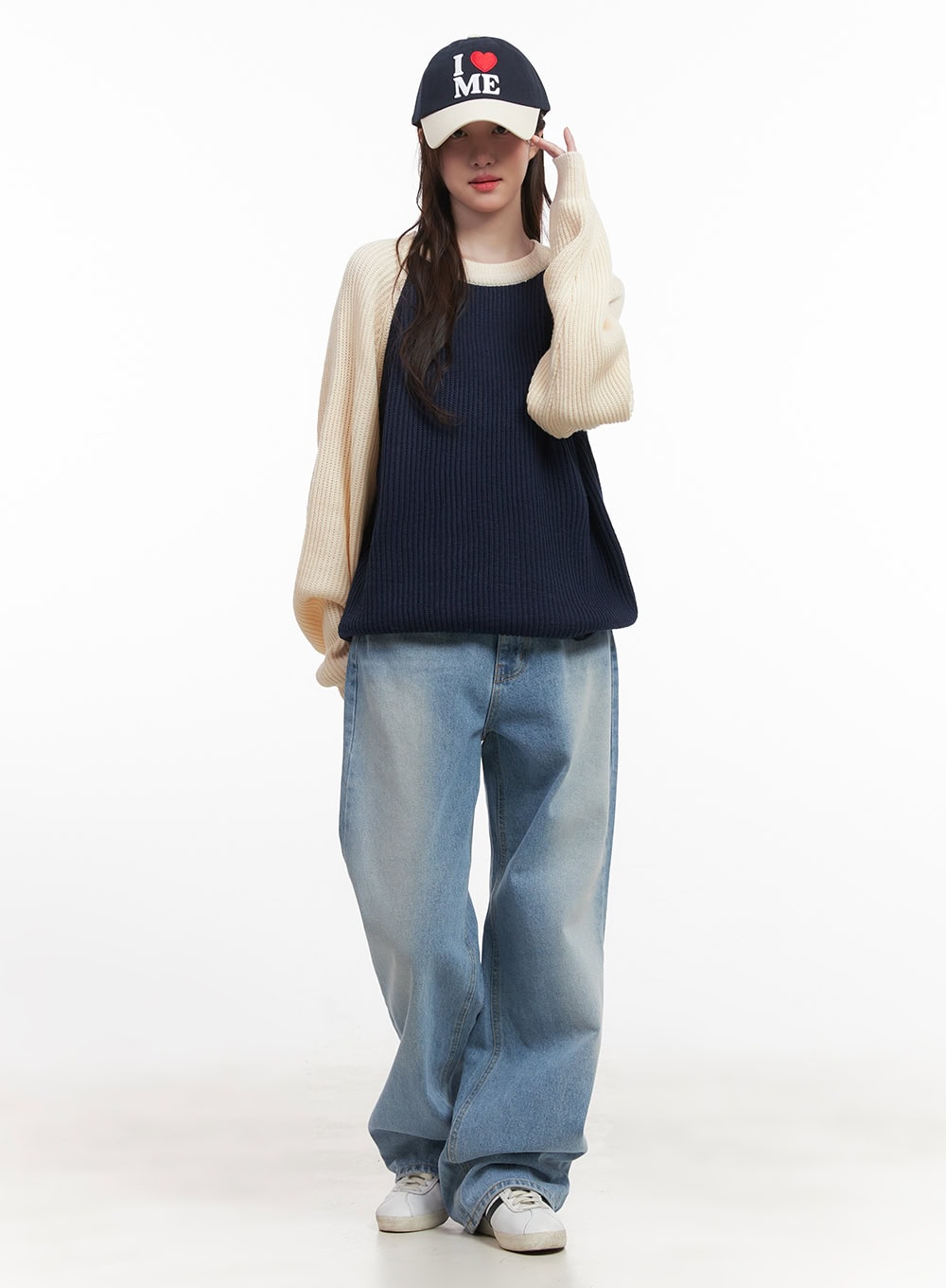 Kelly Washed Baggy Jeans CJ514 in light blue, full-body front worn shot, model in cap and knit layered top, wide-leg washed denim pooling at sneakers, casual street look.