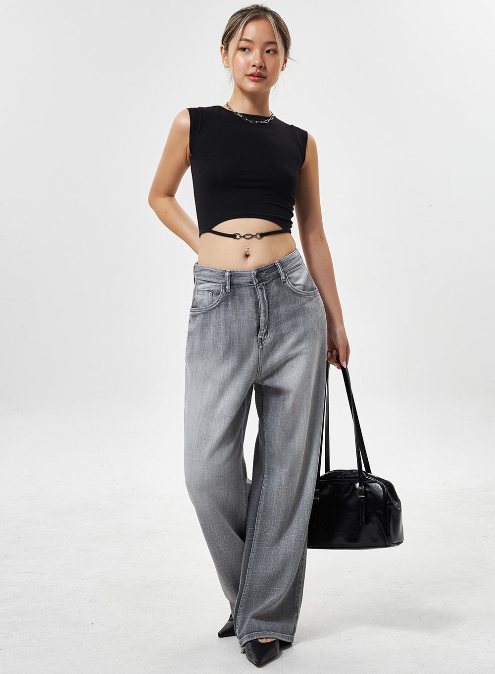 LEWKIN Mid-Rise Wide Leg Jeans CY330 in grey, full-length front shot on model, faded wide-leg cotton denim, paired with black crop top and black bag.