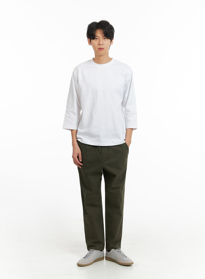 LEWKIN Men's Solid Cotton Straight Fit Pants IA401 in dark green, full-length front view on model, straight fit with elastic drawstring waist, paired with white tee and grey sneakers.