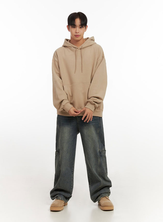 LEWKIN Men's Side Slit Washed Jeans ID406 in vintage blue, full front view on model, wide-leg washed denim with side cargo pockets, styled with beige hoodie and chunky boots.