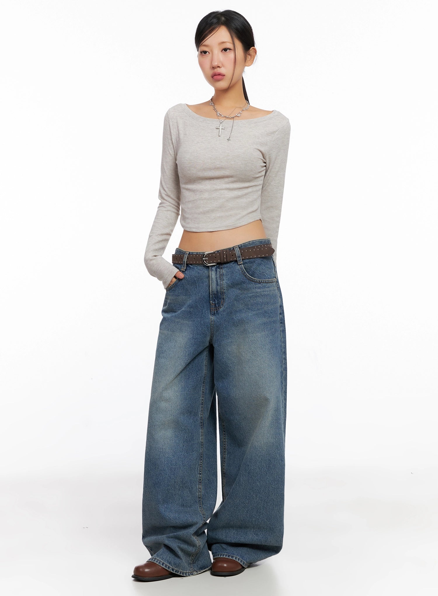 LEWKIN Lilah Wide-Leg Washed Jeans IG527 in mid-blue, front full-body on model, wide-fit cotton denim with washed fade, paired with beige crop top and brown studded belt.