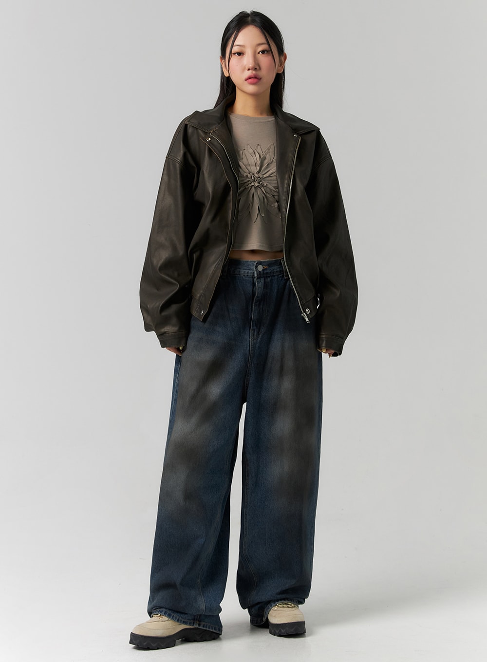 LEWKIN Tie-Dye Washed Wide Leg Jeans CS320 in dark blue, full-body front on model, wide-leg cotton denim with tie-dye wash, paired with dark leather bomber and crop tee.
