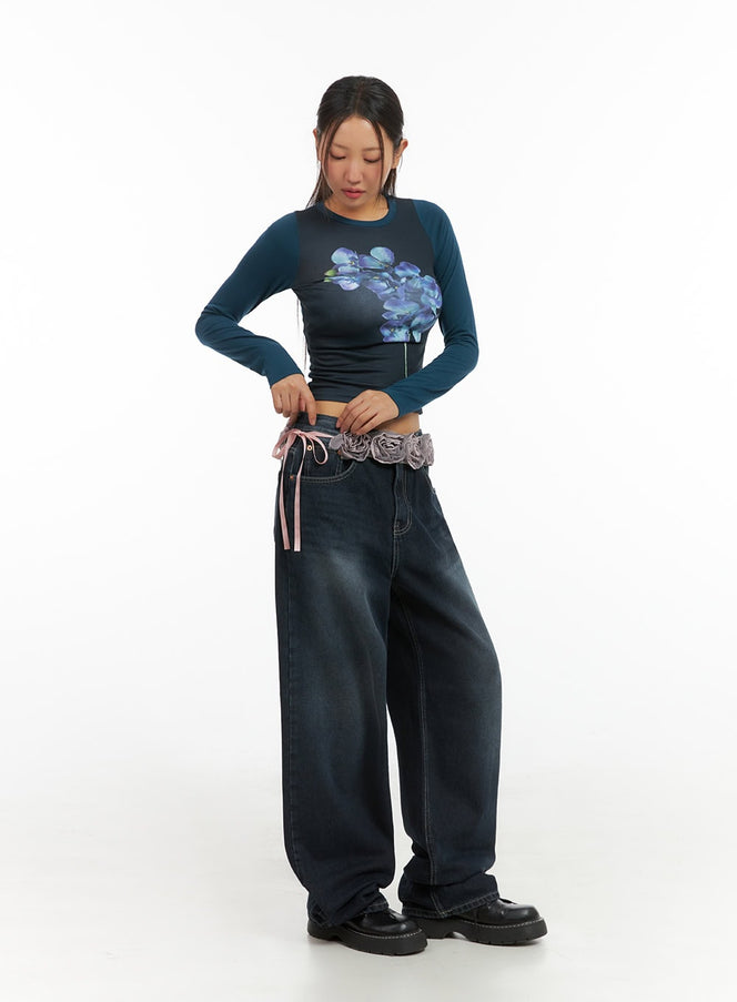 LEWKIN Evelyn Washed Baggy Jeans (Dark Blue) IS402 in dark blue, full-length front on model size 1XL, wide-fit washed denim pooling at hem, styled with floral crop top and decorative belt.