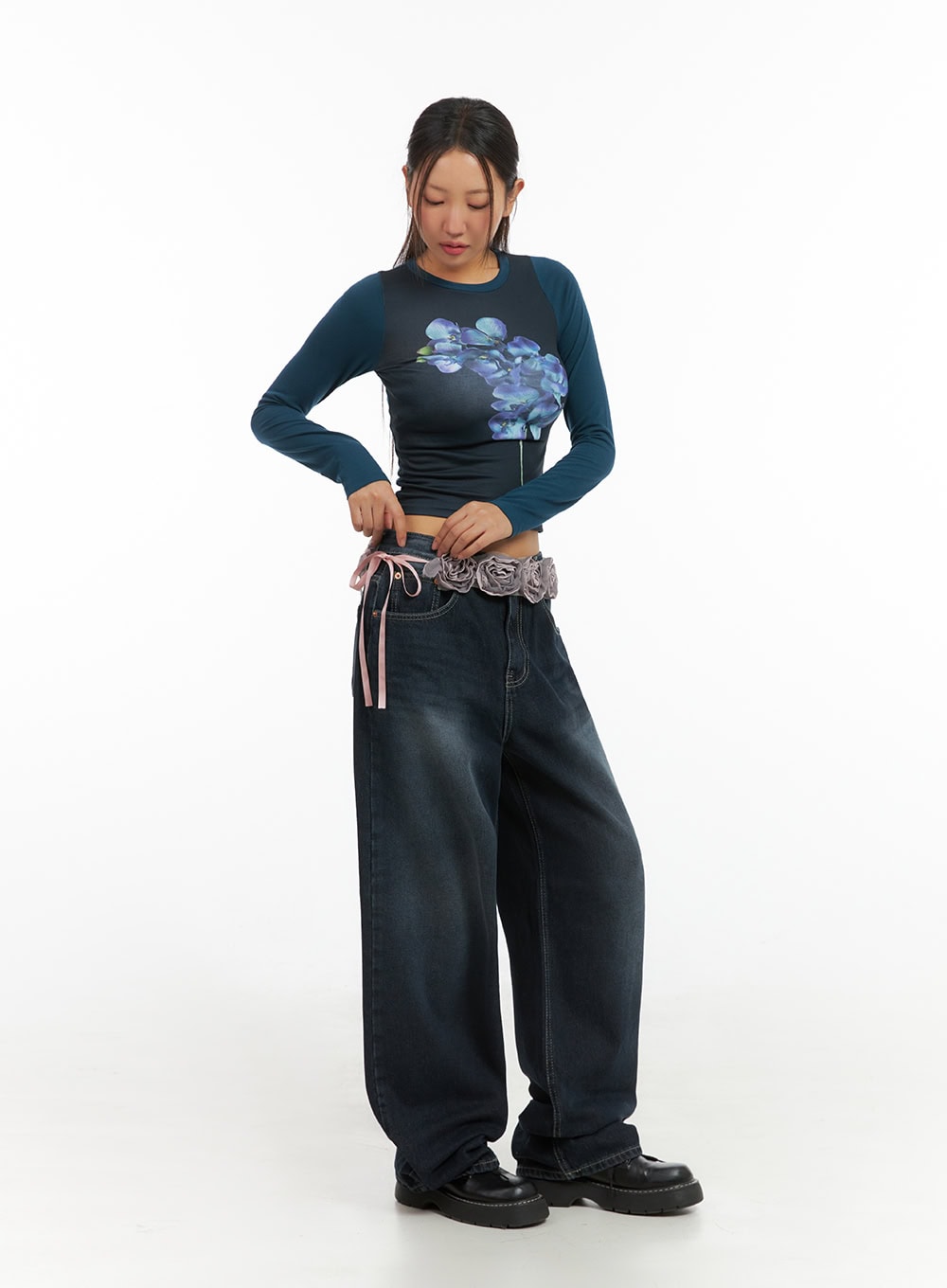 LEWKIN Evelyn Washed Baggy Jeans (Dark Blue) IS402 in dark blue, full-length front on model size 1XL, wide-fit washed denim pooling at hem, styled with floral crop top and decorative belt.