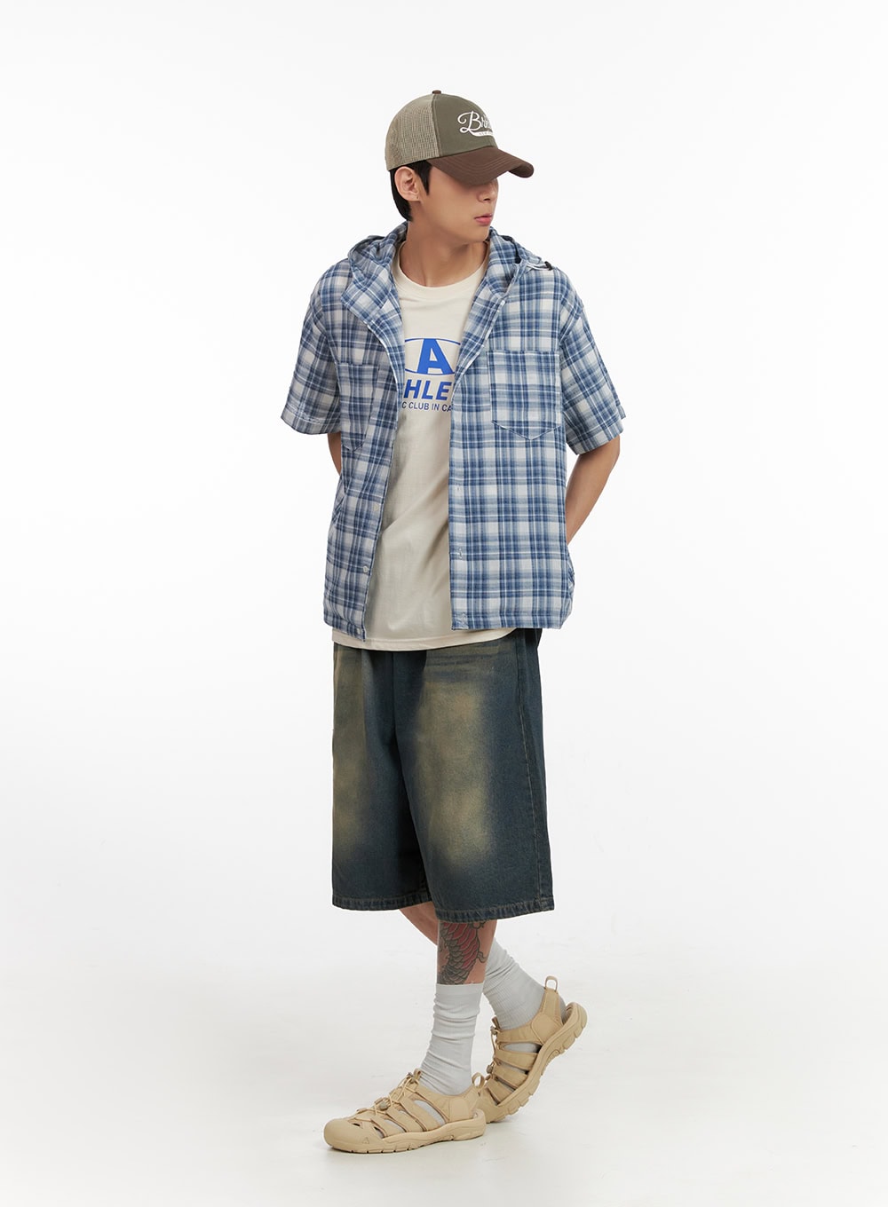 LEWKIN Men's Denim Washed Shorts (Blue) IL404 in blue, 3/4 angle full-body on model, wide-leg washed denim with cargo pockets, styled with plaid hooded shirt and sandals.