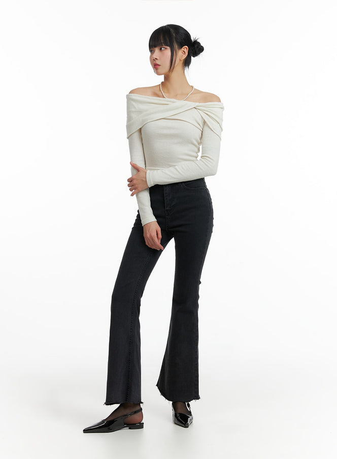 LEWKIN Mid Waist Button Flared Jeans IF402 in dark grey, 3/4 angled full-length shot on model, slim bootcut silhouette with raw-hem flare, paired with off-shoulder cream knit top and black slingback flats.