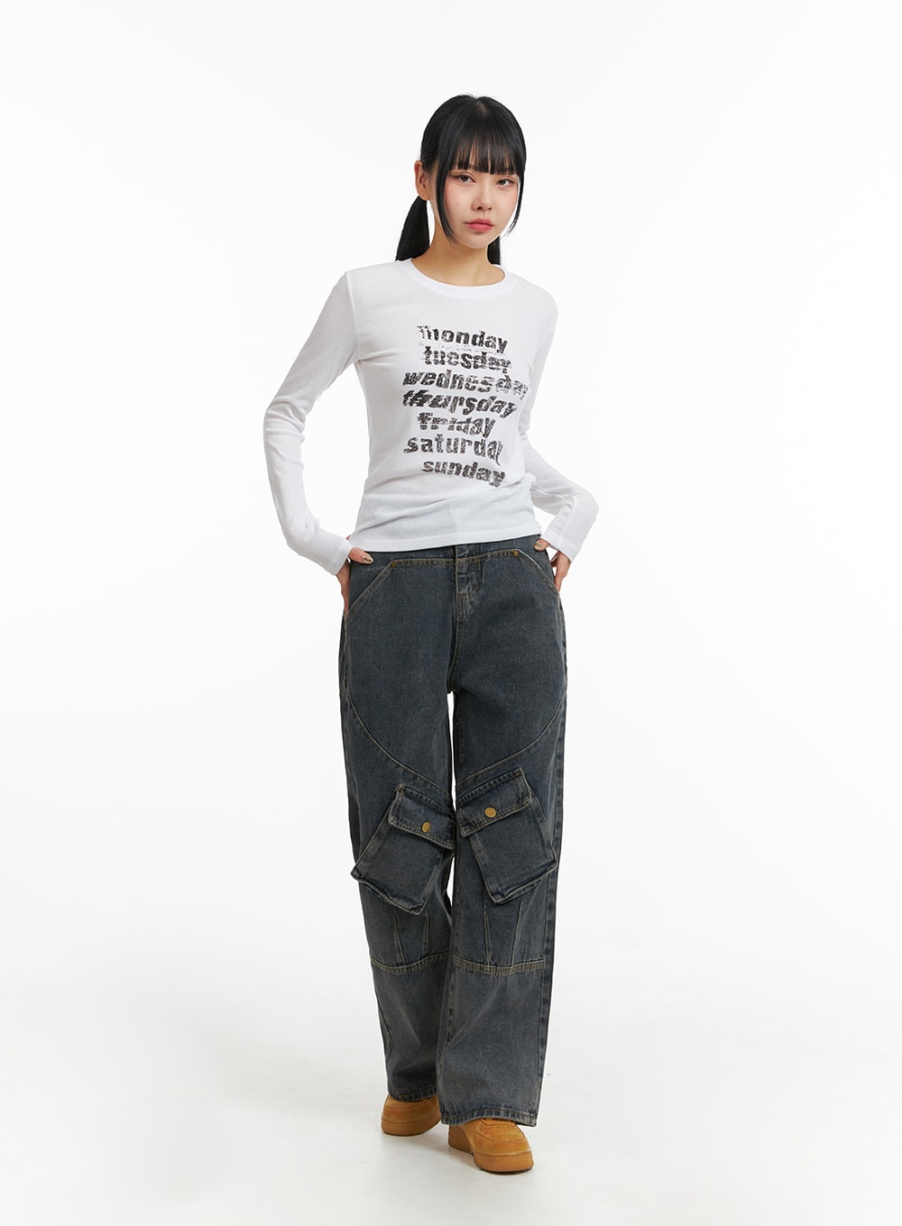LEWKIN Mid Waist Cargo Jeans CJ411 in dark blue, full front view on model, wide-leg washed cotton denim with dual snap cargo pockets, paired with white graphic long-sleeve top.