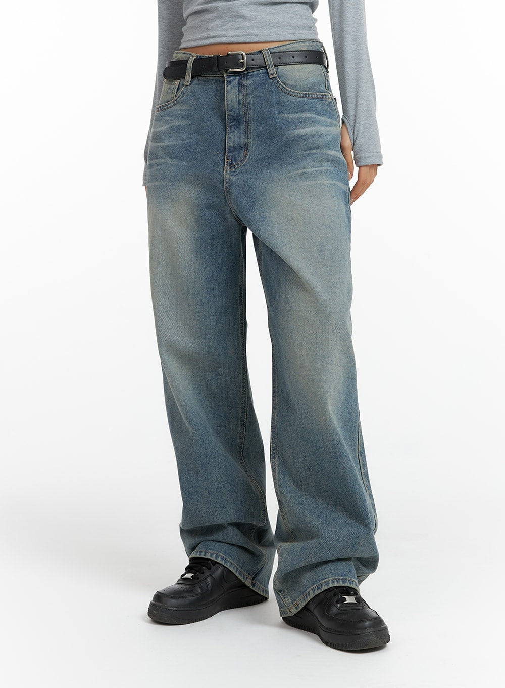 LEWKIN Washed Denim Wide-Leg Jeans CF419 in mid blue, front lower-body shot on model, wide-fit cotton denim with vintage wash, belted waist, paired with grey top and black sneakers.