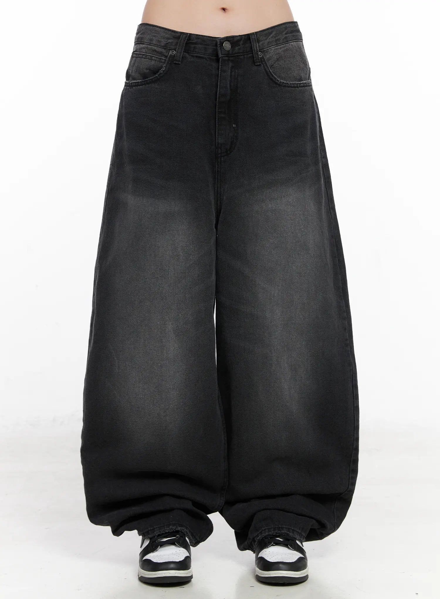 LEWKIN Yuji Dark-Washed Baggy Jeans CN513 in black, front product shot on model from waist down, ultra-wide cotton denim with faded wash, five-pocket styling, pooling hem, paired with black and white sneakers.