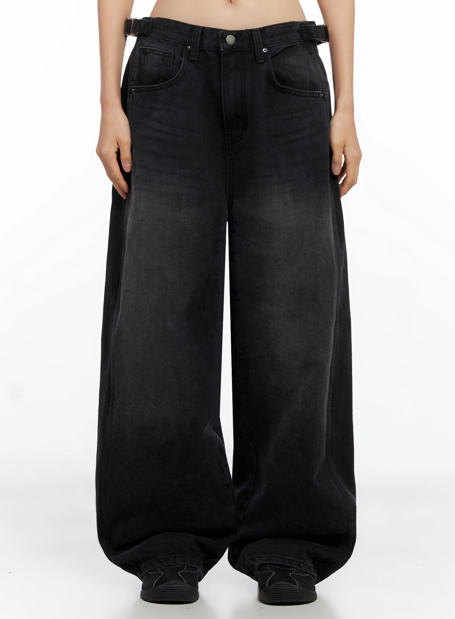 LEWKIN Goffel Side Belt Washed Wide Denim Pants IO517 in black, front product shot on model, ultra-wide cotton leg with washed fade, side belt detail visible, paired with black sneakers.