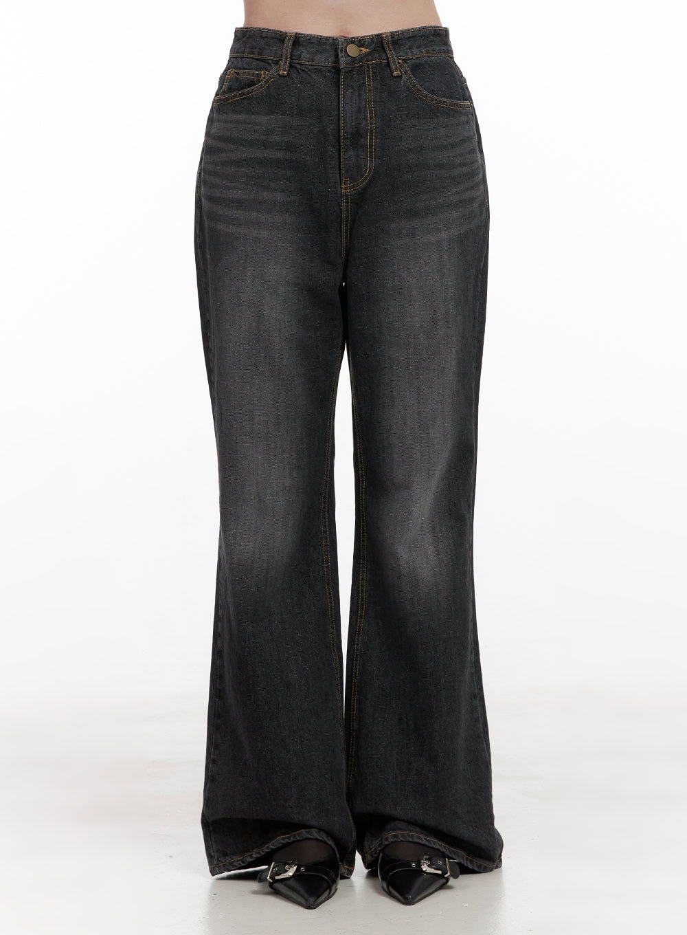 LEWKIN Kiana Cotton Wide Fit Flared Jeans OD403 in black, front product shot on model from waist down, high-rise washed cotton denim with flared leg, gold contrast stitching, paired with black buckle heels.