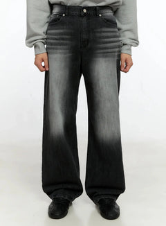 LEWKIN Men's Washed Wide Jeans IN506 in Black, front view on model, washed wide-leg denim with faded gray gradient, paired with gray sweatshirt and black sneakers.