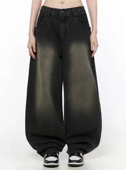 LEWKIN Bodie Vintage Wash Wide Leg Jeans CU519 in black, front full-length on model, vintage-washed denim with khaki fade, balloon wide leg silhouette, paired with sneakers.