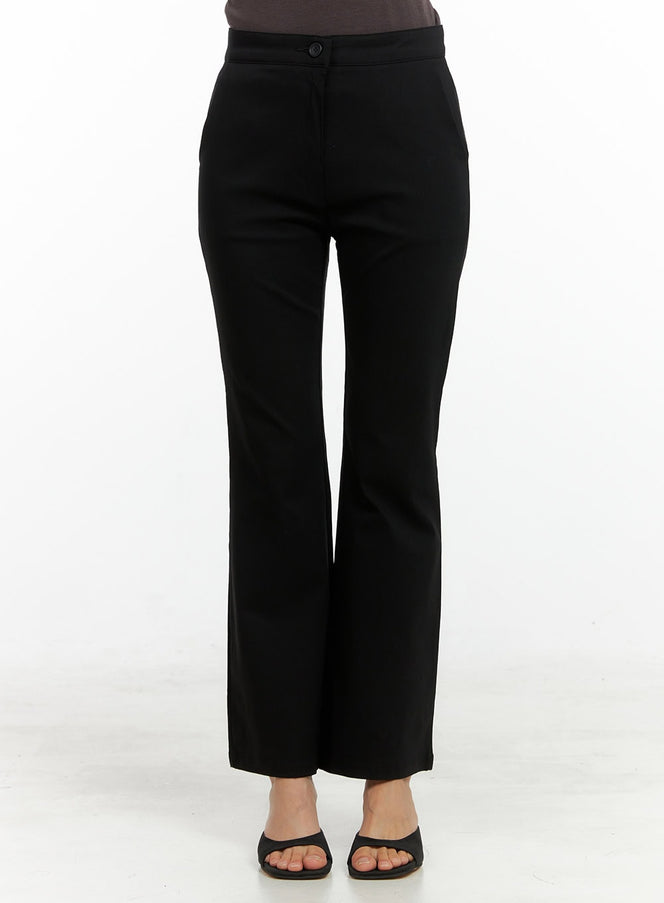 LEWKIN Slim Bootcut Basic Pants OL411 in black, front crop view on model, slim fit tailored trousers with button closure, mid-rise waist, bootcut hem, paired with black mule heels.