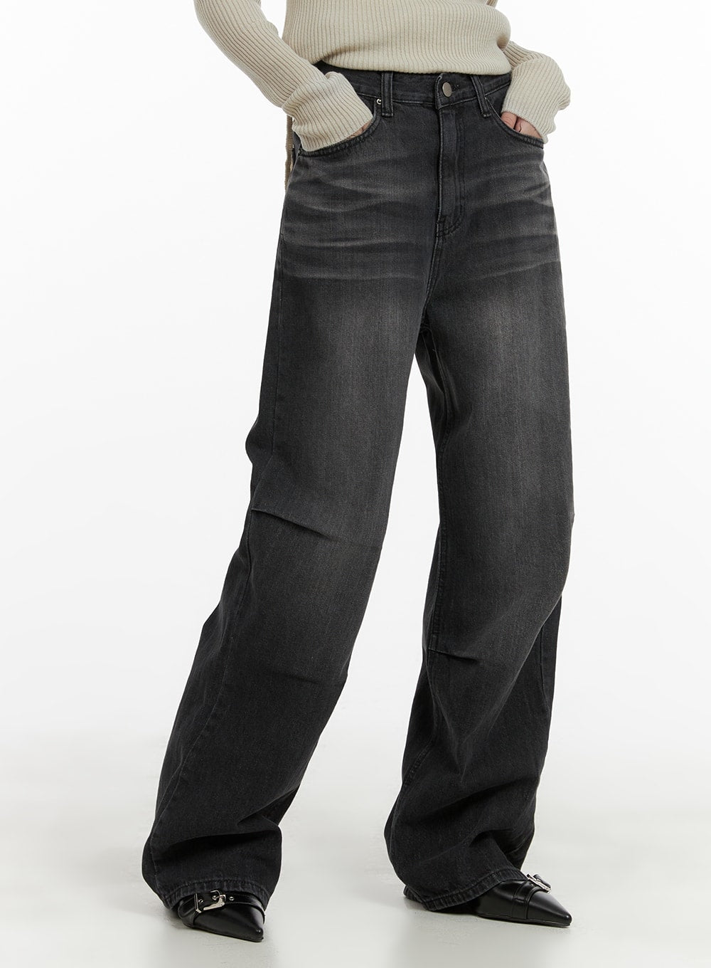 LEWKIN Pintuck Washed Wide Leg Jeans CA403 in Black, angled front view on model, high-waist washed denim with pintuck detail, wide leg silhouette, paired with cream ribbed turtleneck and black buckle flats.