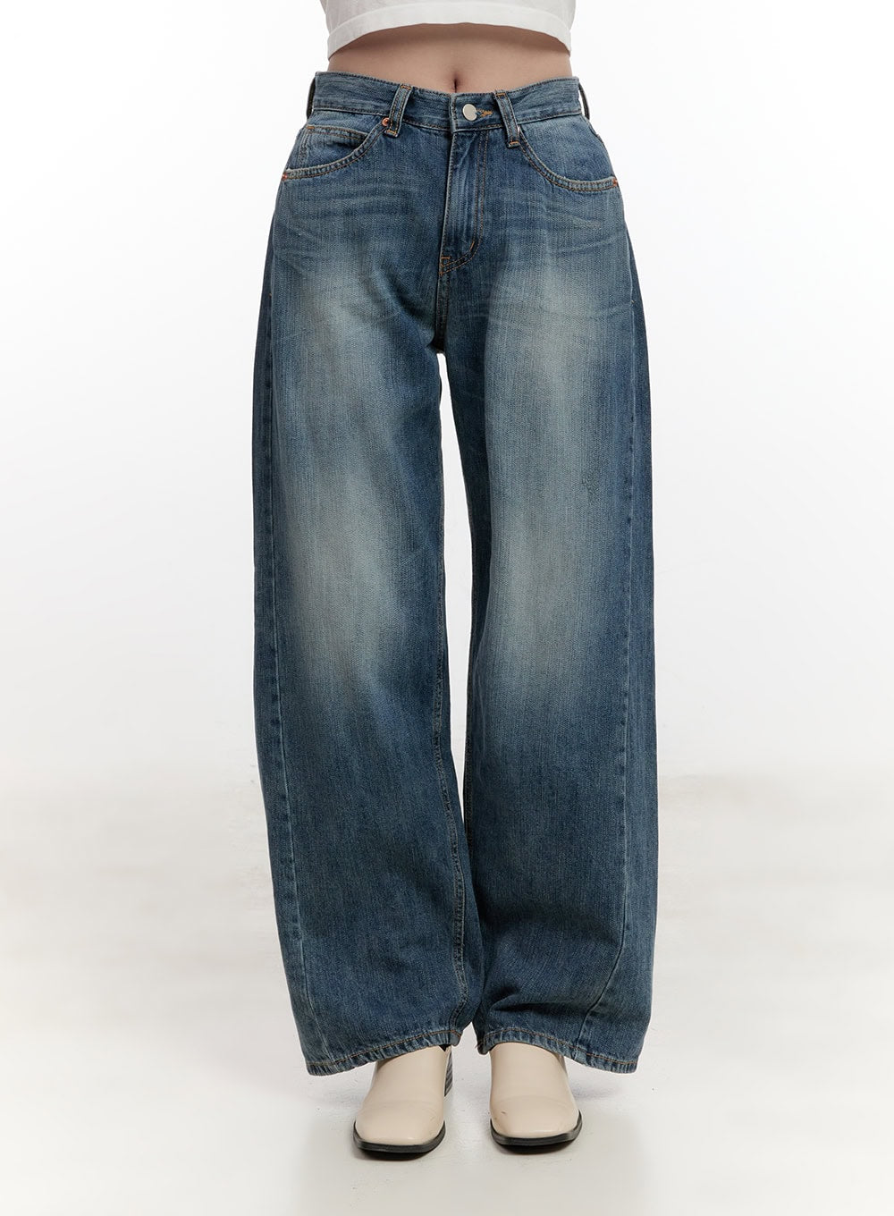 LEWKIN Belle Washed Wide-Leg Jeans CF528 in blue, front view on model cropped at waist, washed cotton denim with faded whiskering, wide-leg silhouette, paired with cream heeled boots.