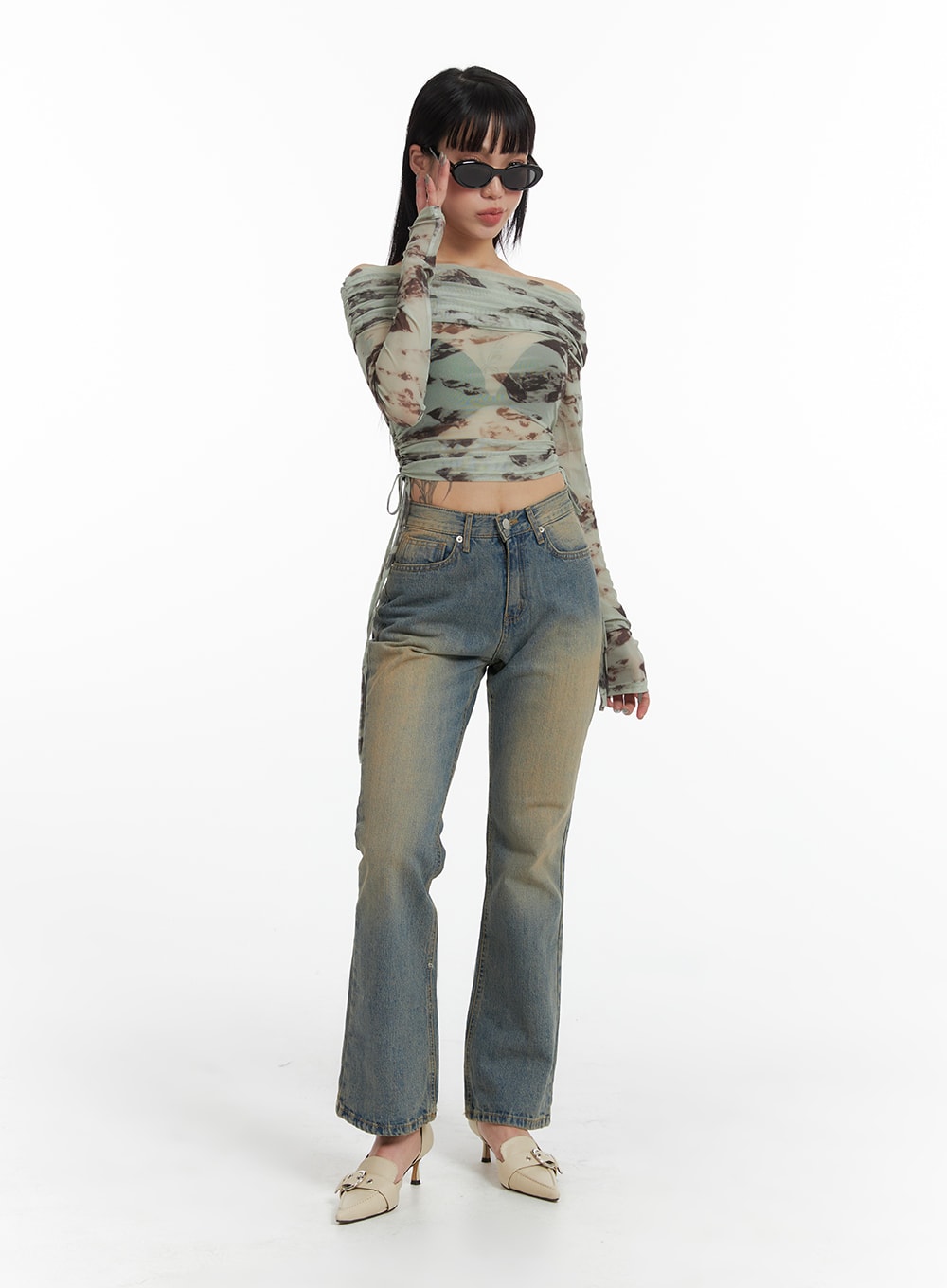 LEWKIN Washed Flared Jeans IF426 in blue, full-length front view on model, slim-fit bootcut denim with vintage wash, paired with printed mesh crop top and cream heels.