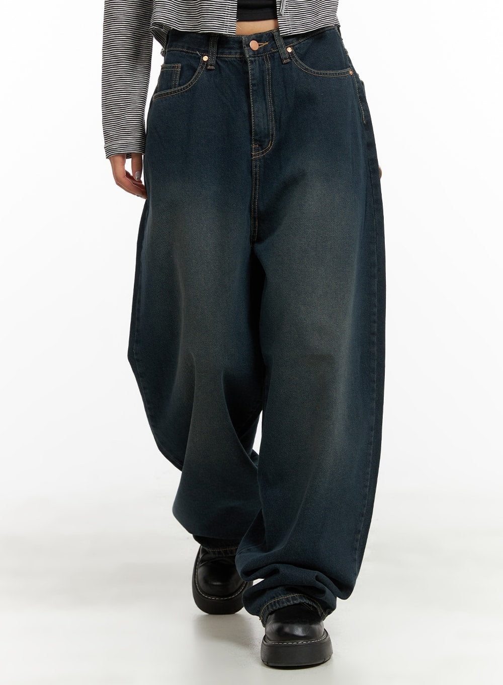 LEWKIN Washed Denim Baggy Jeans CA415 in blue, front waist close-up on model, wide-fit cotton denim with washed finish, gold hardware, paired with striped top and black chunky loafers.