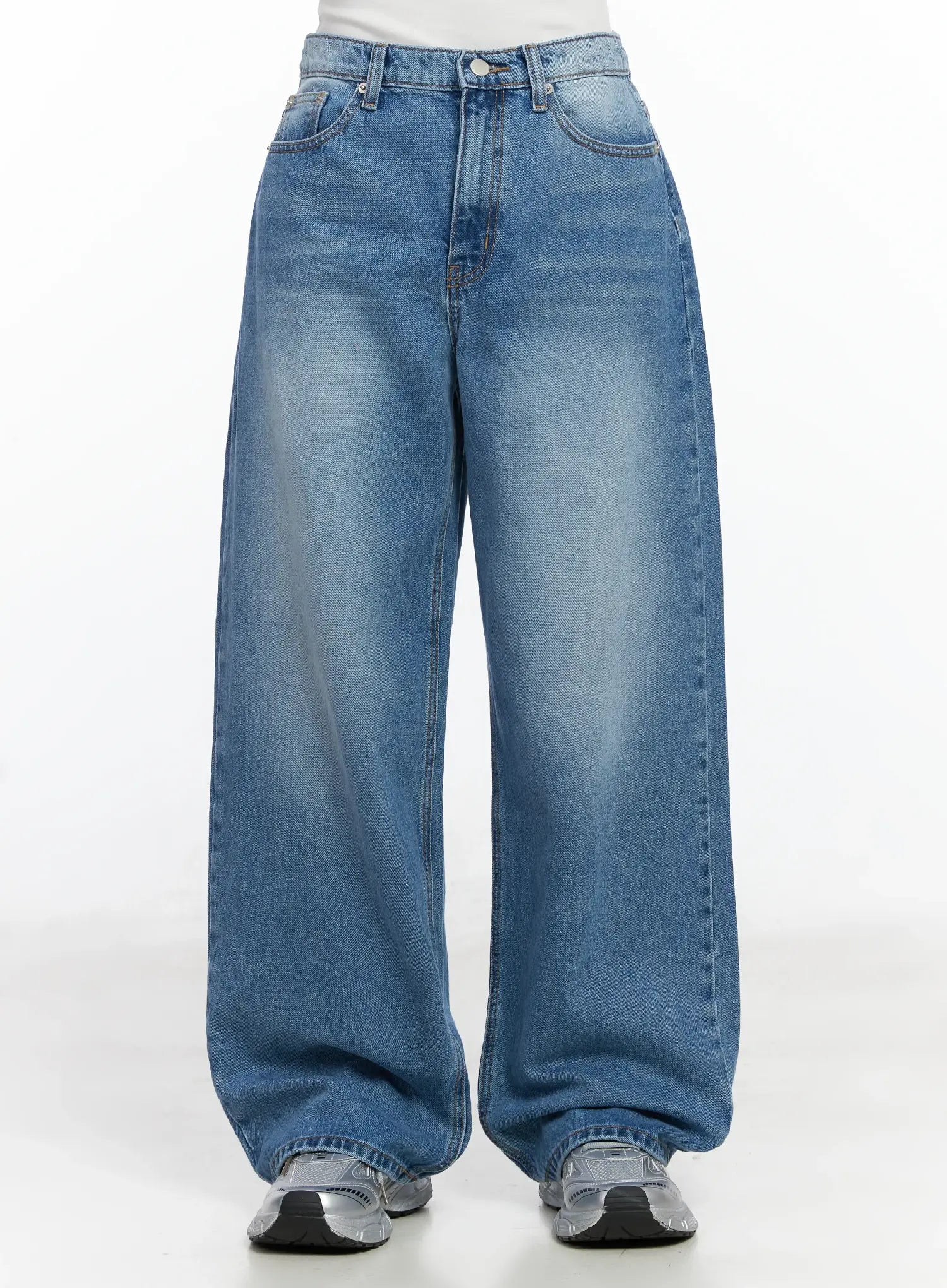 LEWKIN Iliana Wide Leg Jeans IJ529 in blue, front crop view on model, baggy wide-fit washed cotton denim with five-pocket styling, paired with silver sneakers.