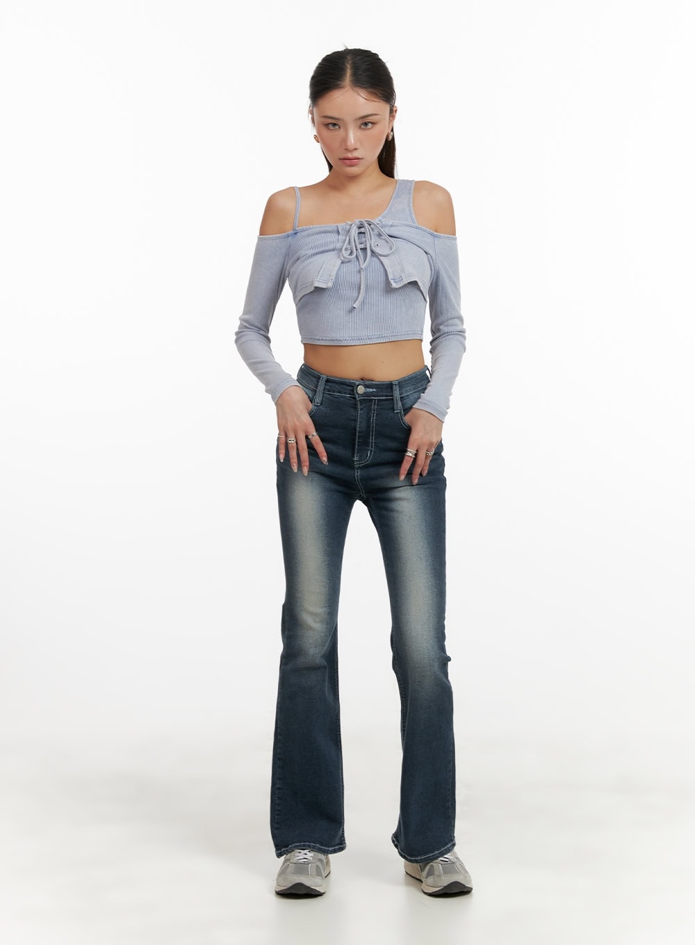 LEWKIN Washed Denim Slim Fit Bootcut Jeans CY402 in blue, full-length front on model, slim fit with bootcut flare, washed denim, paired with grey cold-shoulder crop top and sneakers.