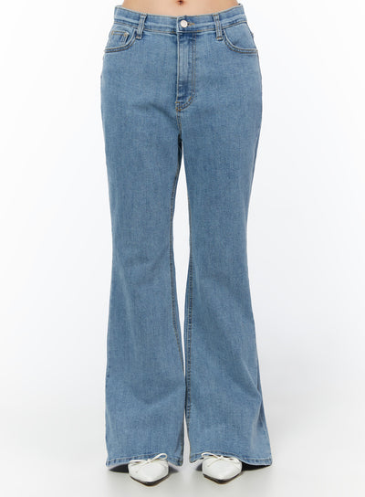 LEWKIN Leana Stretch Bootcut Jeans IU519 in blue, front crop view on model, normal-fit washed cotton-spandex denim, bootcut flare hem, 5-pocket, styled with white ballet flats.