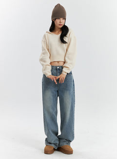 LEWKIN Mid Waist Washed Button Wide Leg Jeans OD320 in blue, full-body front on model, wide-leg washed denim with button fly, styled with cream crop hoodie knit and beanie.