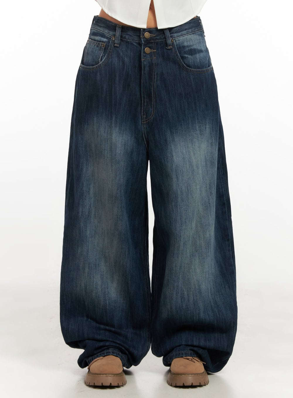 LEWKIN Jessica Wide-Fit Denim Jeans CN426 in blue, front waist-down shot on model, baggy wide-leg silhouette with double-button closure, washed cotton denim, worn with beige chunky loafers.