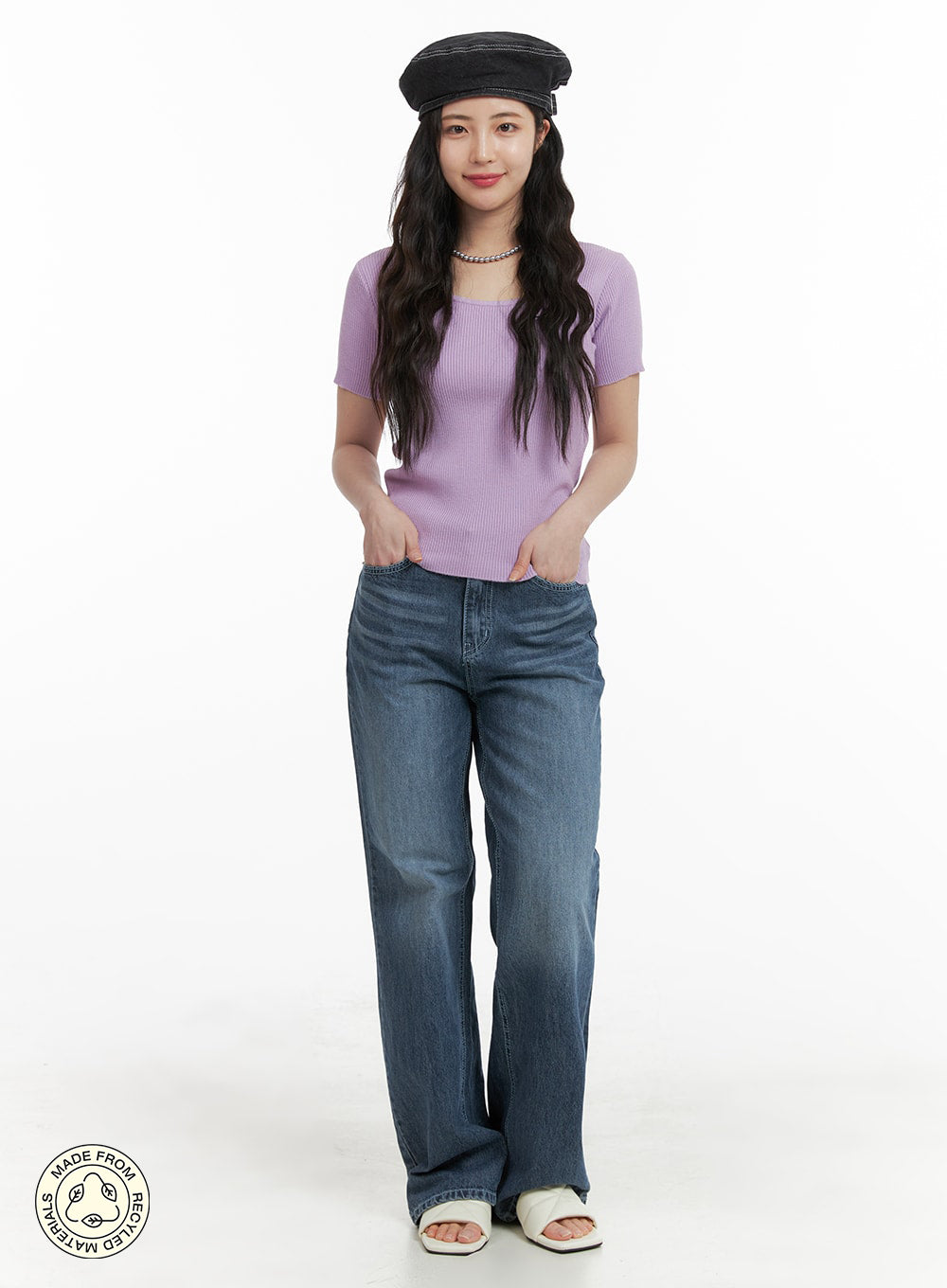LEWKIN Recycled Light Washed Straight Jeans OM425 in blue, full-body front shot on model, straight fit washed denim, paired with lavender ribbed top and baker boy hat.