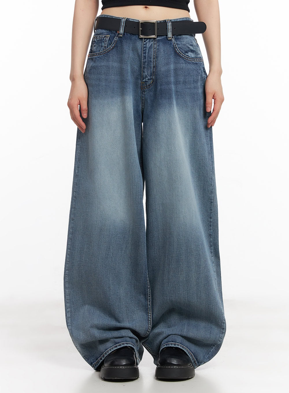 LEWKIN Pauline Wide-Leg Baggy Jeans CY512 in blue, front crop shot on model, washed cotton denim, ultra-wide baggy leg, black belt, black platform loafers.