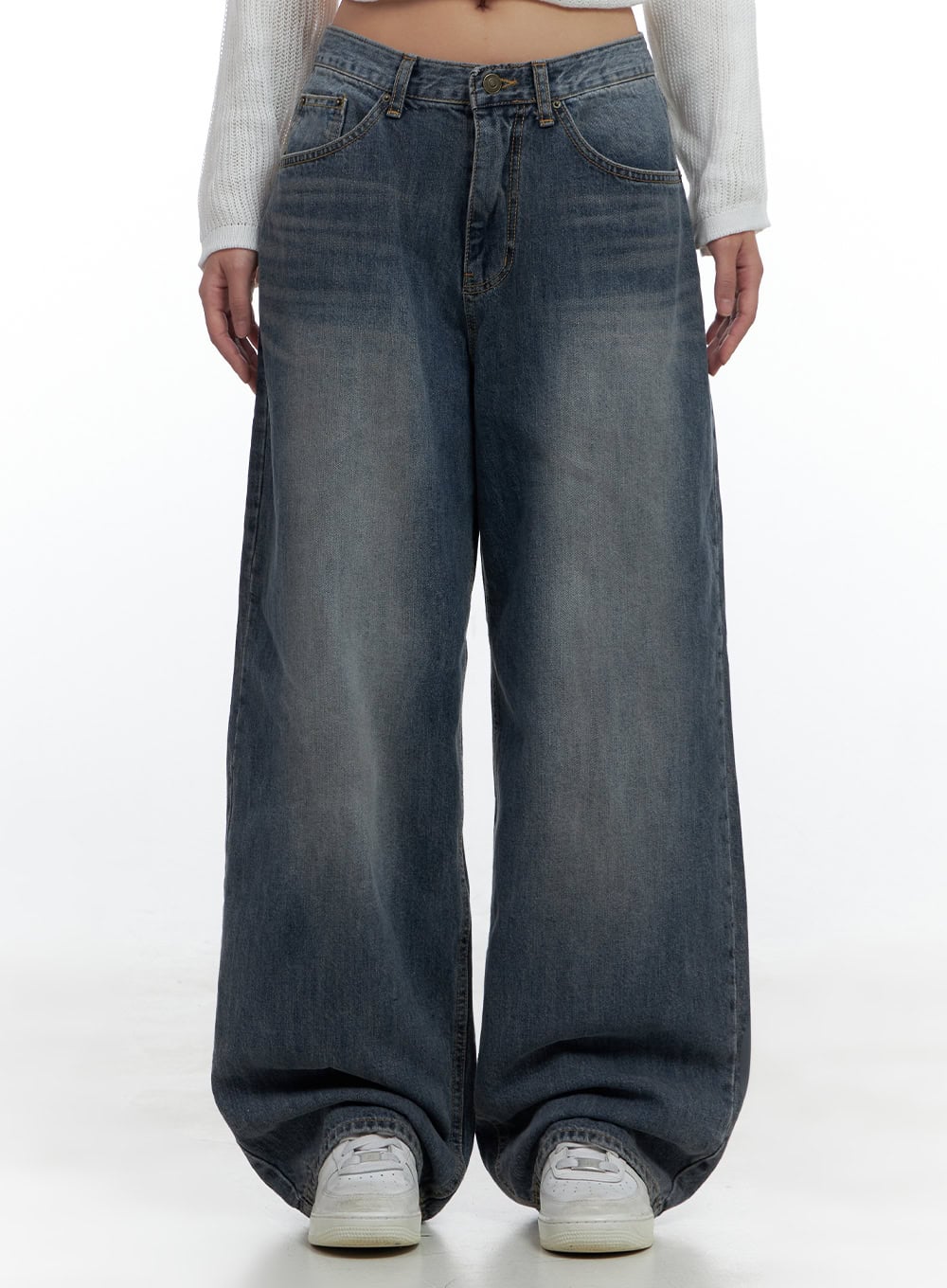 LEWKIN Lana Oversized Wide-Leg Jeans CS425 in blue, front waist-to-hem crop shot on model, washed cotton denim, ultra-wide baggy leg pools over white sneakers, paired with white knit crop top.