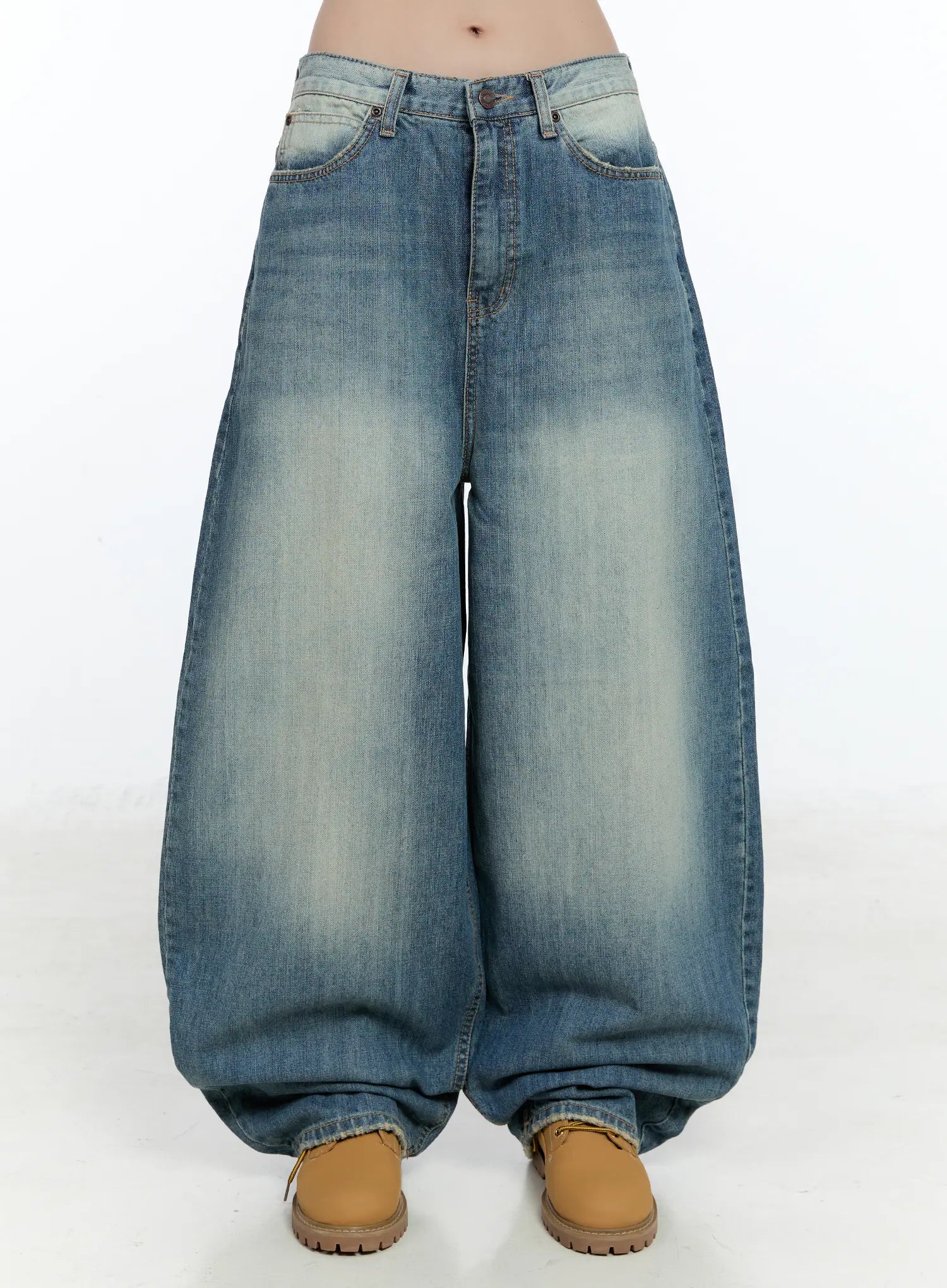 LEWKIN Jiso Baggy Wide Jeans CN517 in blue, front product shot on model, washed cotton baggy wide leg with faded whisker detail, cropped at waist, styled with tan chunky boots.