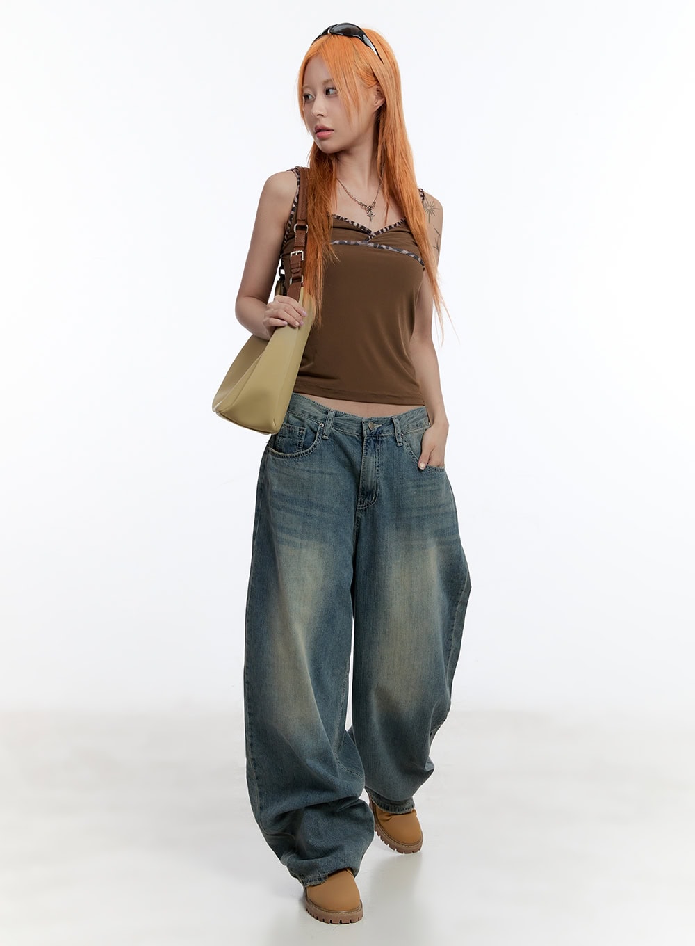 LEWKIN Jenna Relaxed-Fit Wide-Leg Jeans CU502 in blue, full-length front on model walking, low-rise washed denim with baggy wide leg, styled with brown cami top and tan chunky boots.