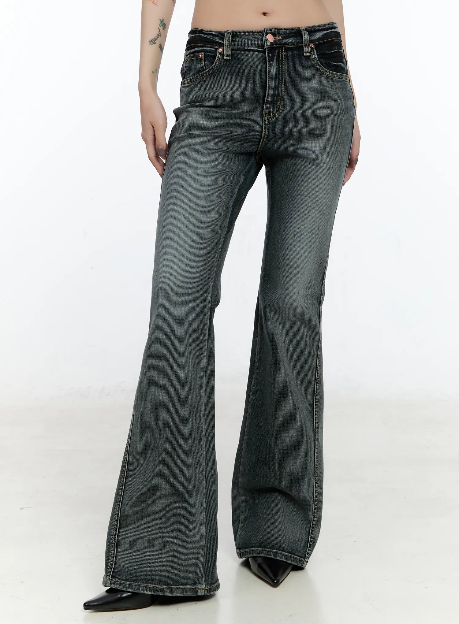 LEWKIN Judith Washed Bootcut Jeans CN517 in blue, front three-quarter crop on model, washed grey-blue cotton-spandex denim, normal fit with contrast stitching, paired with black pointed heels.