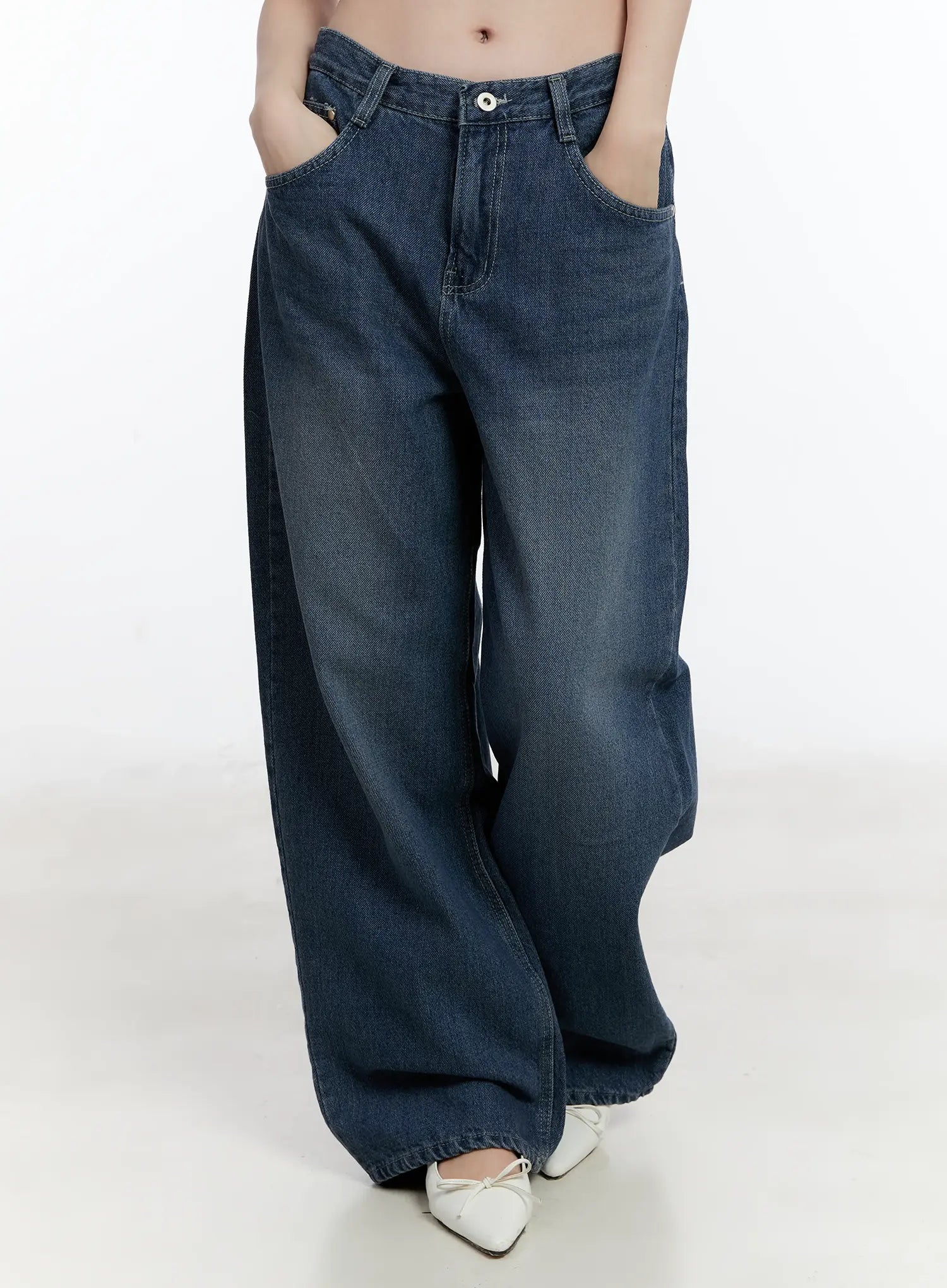 LEWKIN Della Casual Denim Wide Jeans ID511 in blue, front crop shot on model, hands in pockets, washed cotton wide-leg silhouette, long length, styled with white ballet flats.