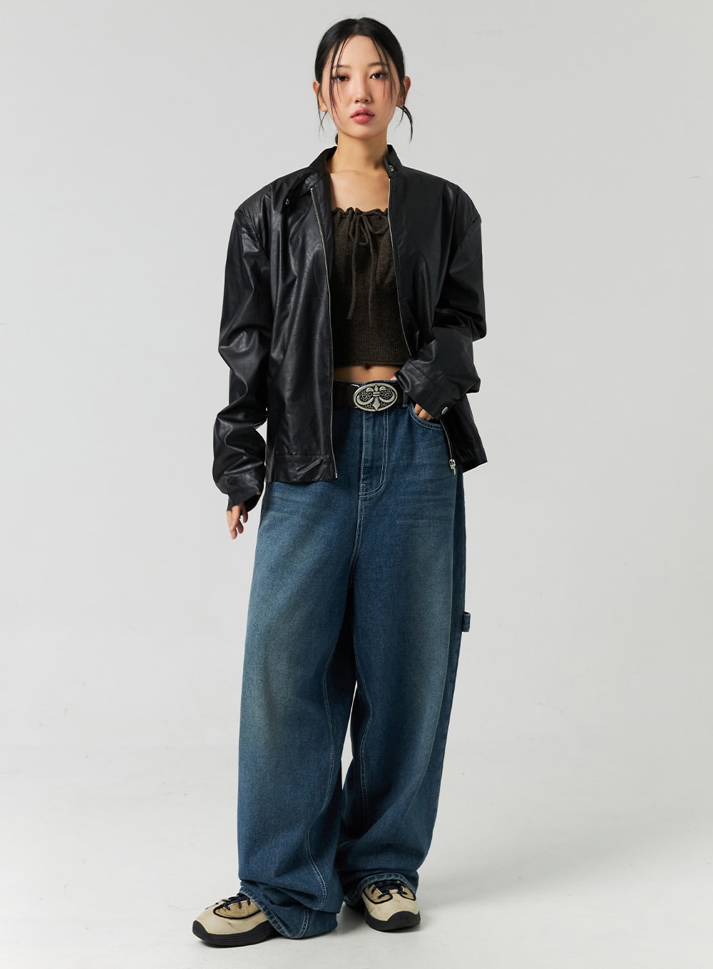 LEWKIN Washed Cotton Wide Leg Jeans CO323 in blue, full-body front view on model, oversized wide leg with washed denim finish, paired with black leather jacket and brown crop top.