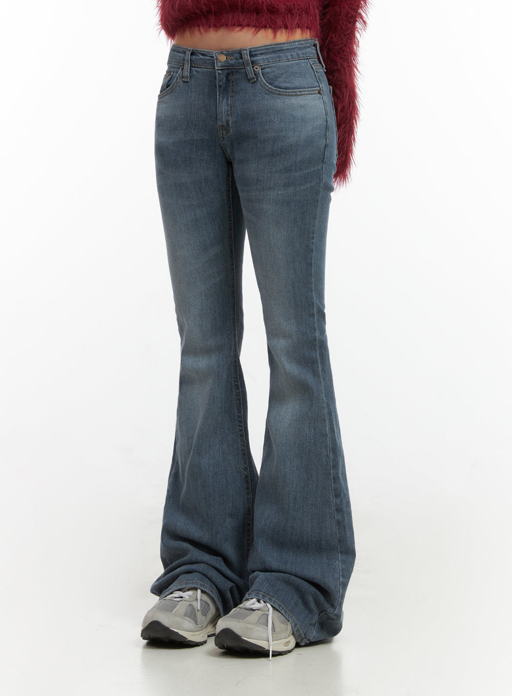 LEWKIN Liv Washed Denim Low Waist Bootcut Jeans CO414 in blue, front close-up on model, slim-fit washed denim with low waist, flared hem, paired with red fluffy crop top and sneakers.