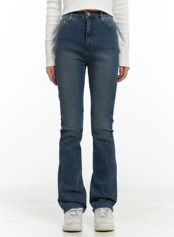 LEWKIN Pixie Slim Washed Bootcut Jeans CG427 in blue, front product shot on model, slim high-rise washed denim with subtle bootcut flare, paired with white long-sleeve top and sneakers.