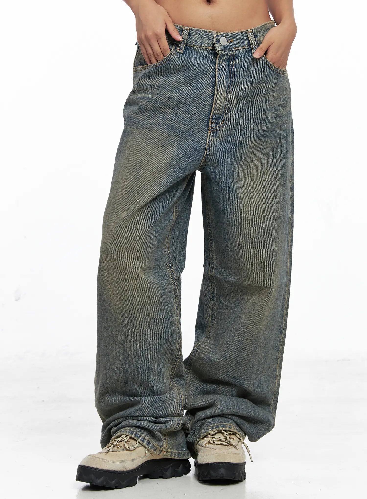 LEWKIN Denver Vintage Washed Semi-Wide Jeans CO513 in blue, front cropped shot on model showing wide-leg silhouette, low-rise waist, vintage wash cotton denim with amber tint, paired with chunky sneakers.