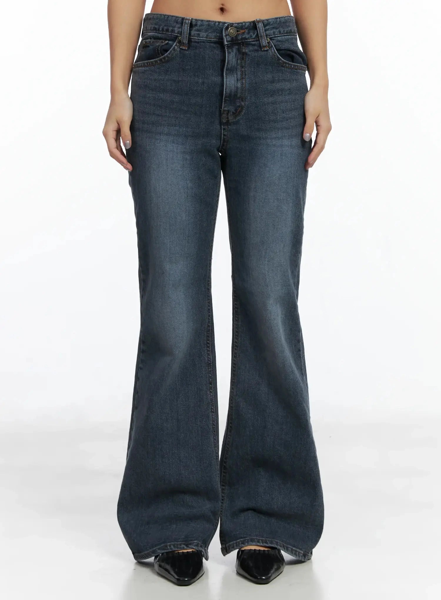 LEWKIN Rara Fleece Flared Jeans ID503 in blue, front crop view on model, washed cotton bootcut silhouette with mid-rise waist, front pockets, and brass button, paired with black pointed flats.