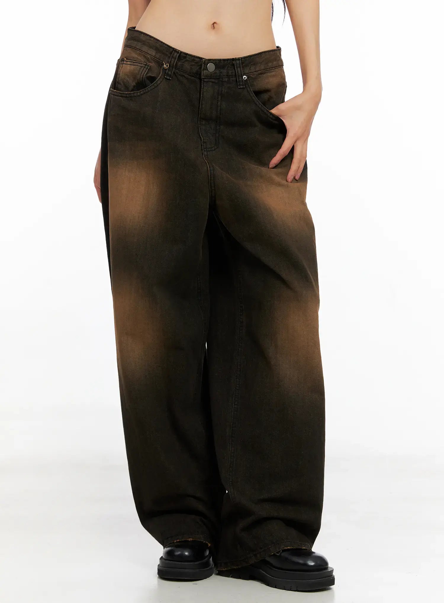 LEWKIN Analia Washed Wide-Leg Jeans CO529 in brown, front three-quarter view on model, low-rise wide fit cotton denim with washed fading, paired with black chunky loafers.