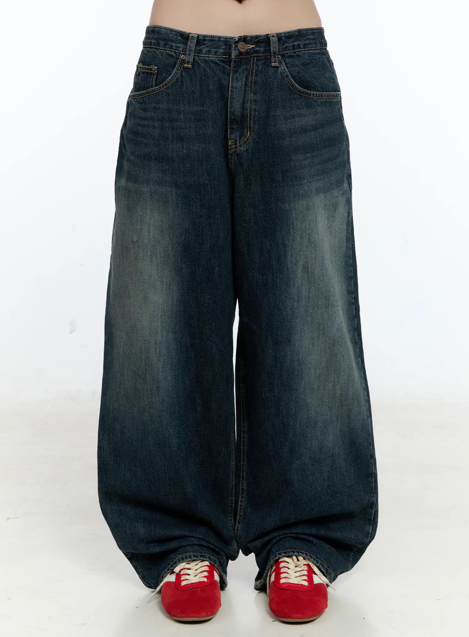 LEWKIN Hunter Washed Wide Leg Jeans CN517 in dark blue, front view on model, extreme wide-leg cotton denim with washed fading, five-pocket styling, paired with red sneakers.