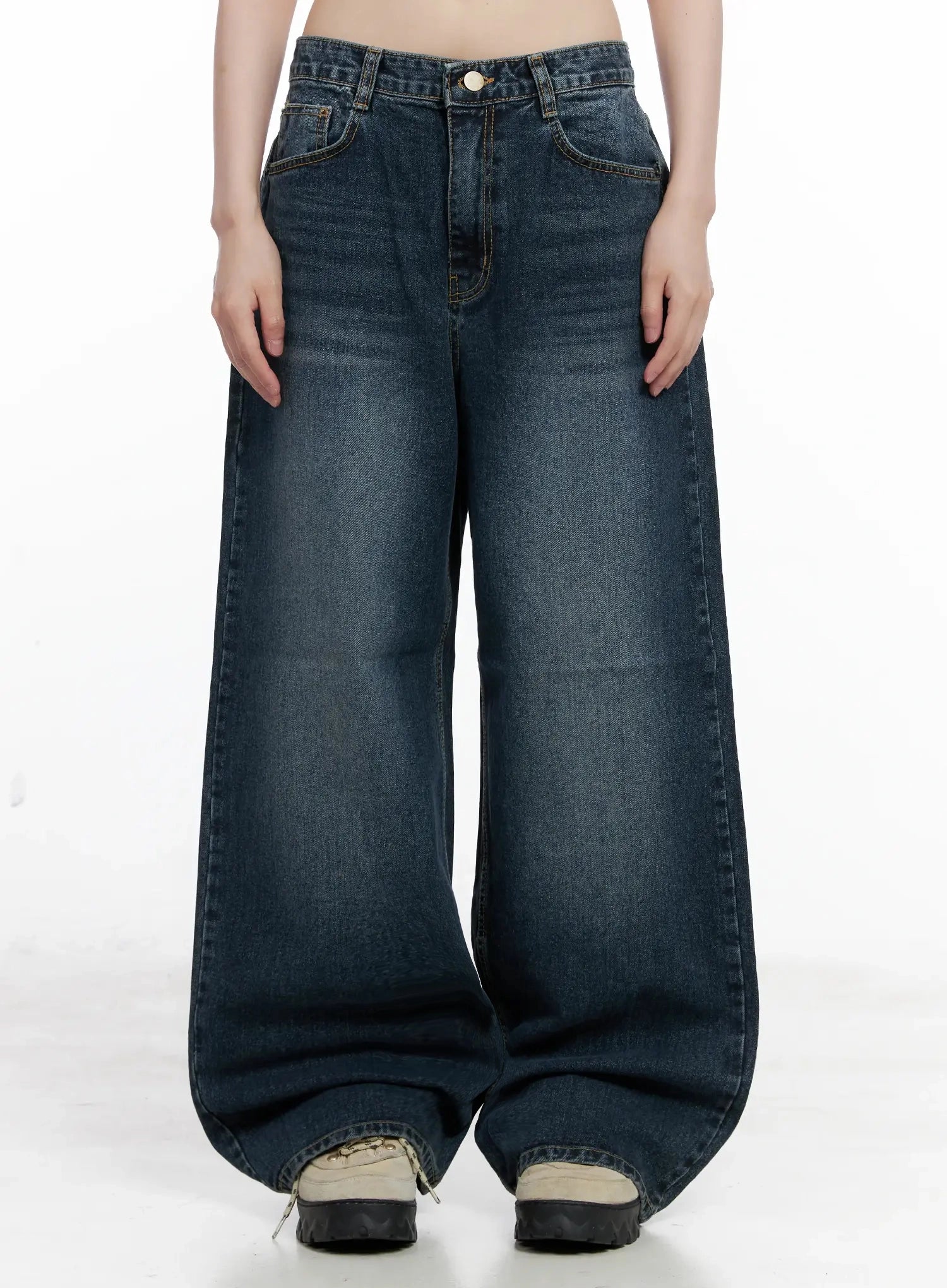 LEWKIN Mashiro Vintage-Wash Wide Jeans IL531 in dark blue, front product shot on model, cropped waist view showing wide-leg cotton denim with vintage wash, gold-tone button, and front pockets, styled with chunky sneakers.