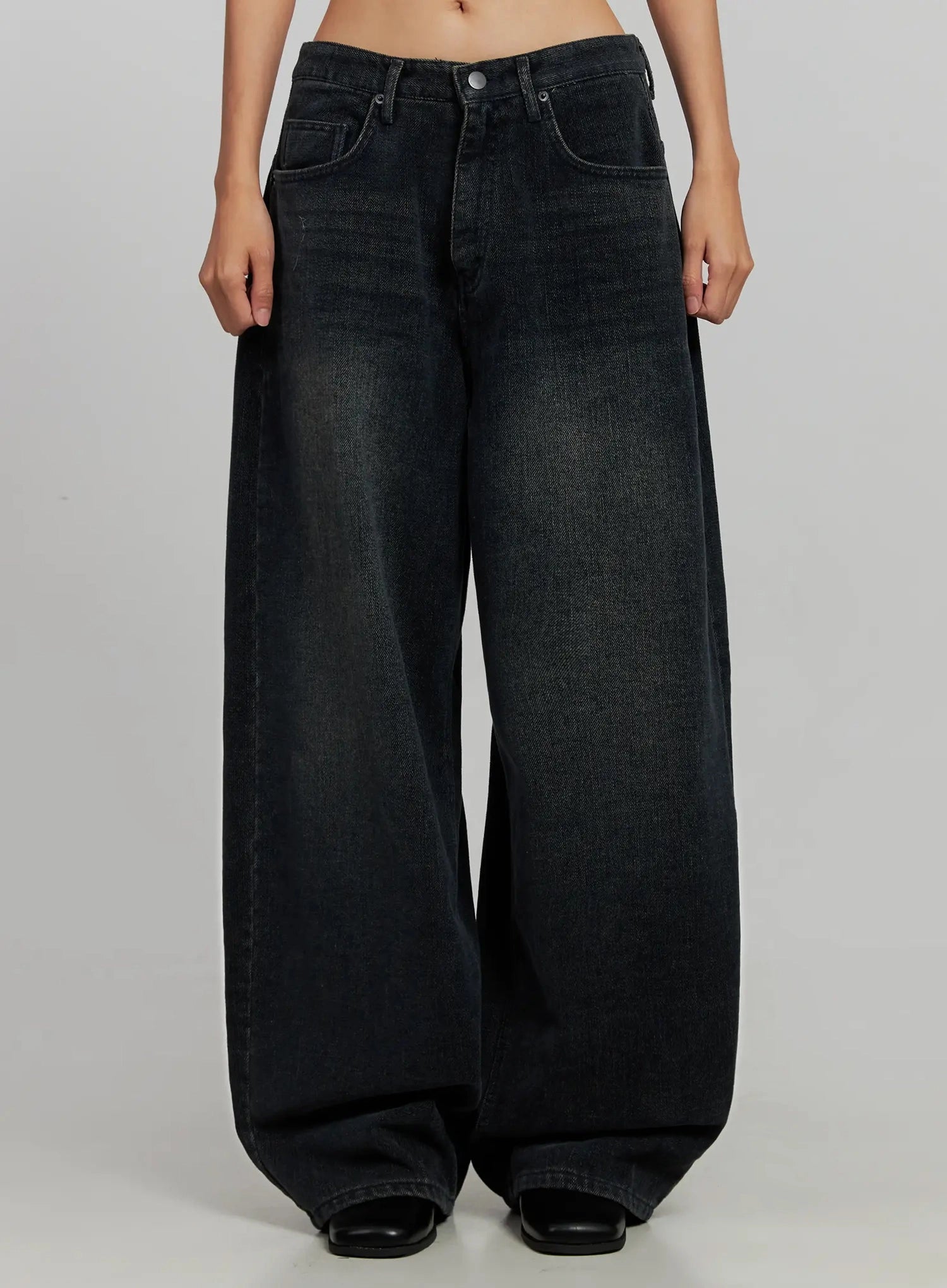 LEWKIN Aubree Washed Wide Jeans IJ502 in dark blue, front product shot on model, cropped to waist-to-hem, extreme wide-leg cotton denim with vintage wash, worn with black mules.