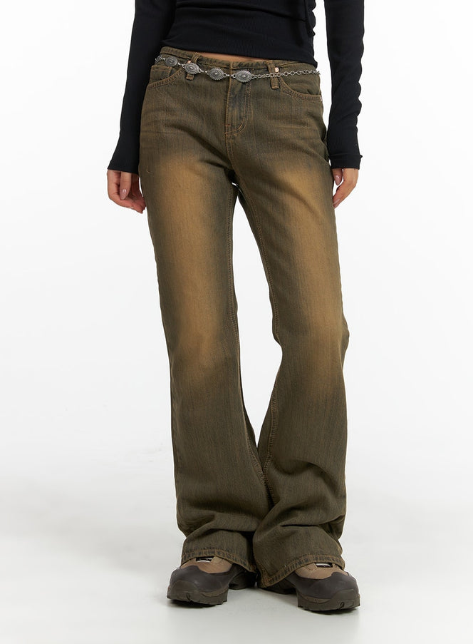LEWKIN Vintage Washed Flared Jeans CM411 in dark blue, front cropped view on model, slim-fit bootcut denim with vintage brown wash, styled with silver concho chain belt and chunky shoes.