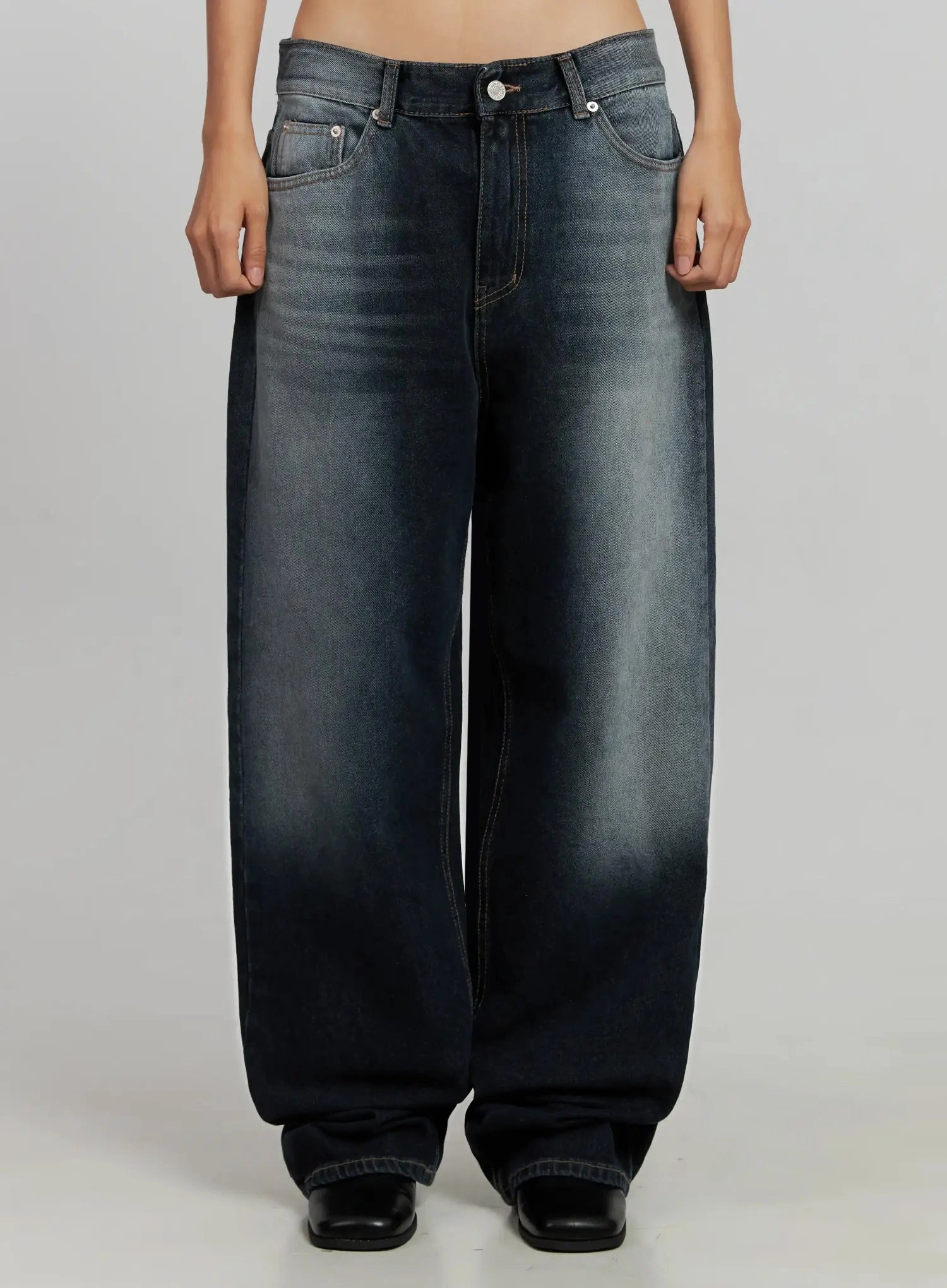 LEWKIN Chaya Washed Wide Jeans IJ505 in dark blue, front crop view on model, low-rise wide-leg cotton denim with washed fading and contrast stitching, paired with black boots.